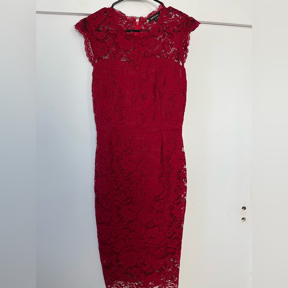 Wine red, form-fitting, lace dress.